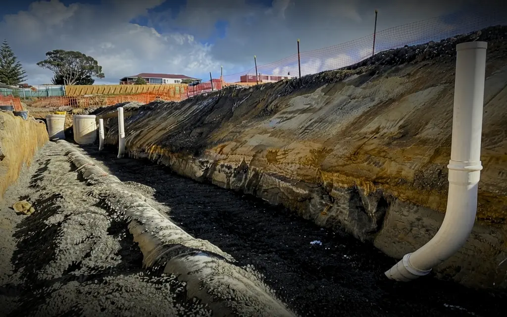 Wastewater drainage pipes being installed on a Hamilton building site